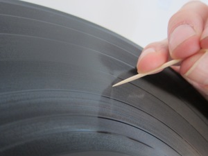 mending a scratched record with a toothpick